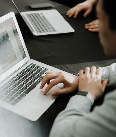 Focused shot of someone using their laptop's trackpad