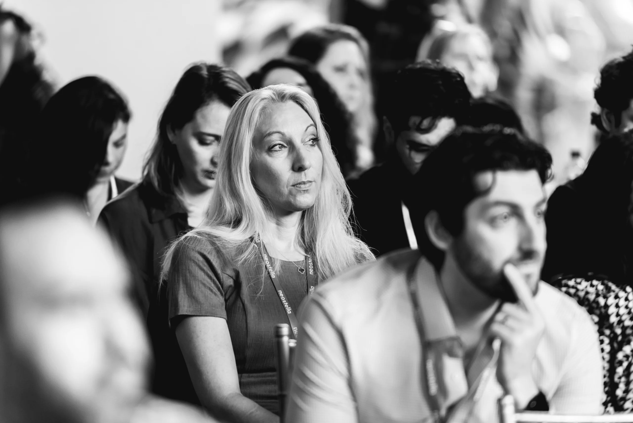 Neostella team members collaborating and engaging in conversations.