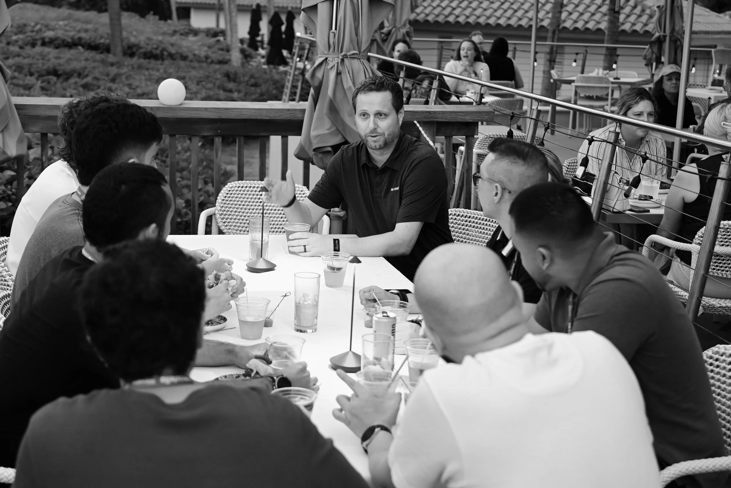 Neostella team members collaborating and engaging in conversations.